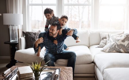 Father and sons playing in a well ventilated home